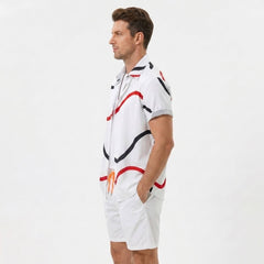 Three quarter view of man in white line print shirt and swim shorts on plain background