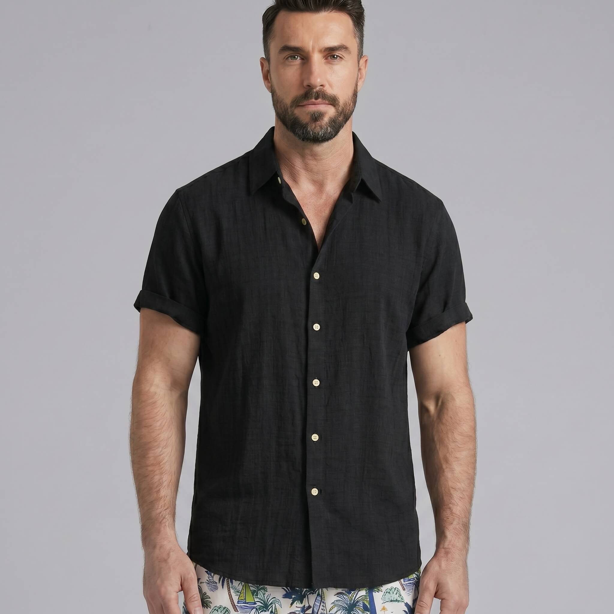 Man wearing white linen rayon shirt and white palm tree swim shorts relaxed outdoor lifestyle scene