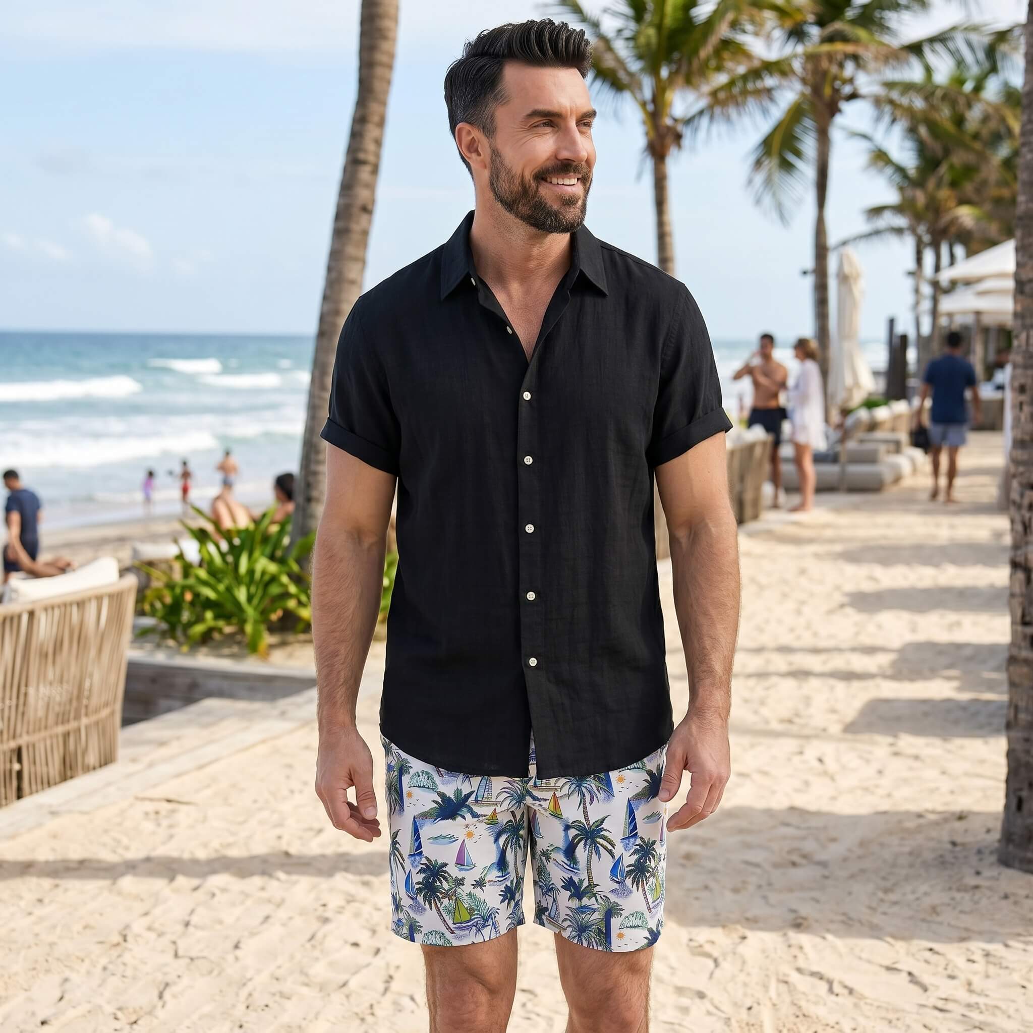 Man wearing white linen rayon shirt and white palm tree swim shorts in tropical outdoor lifestyle