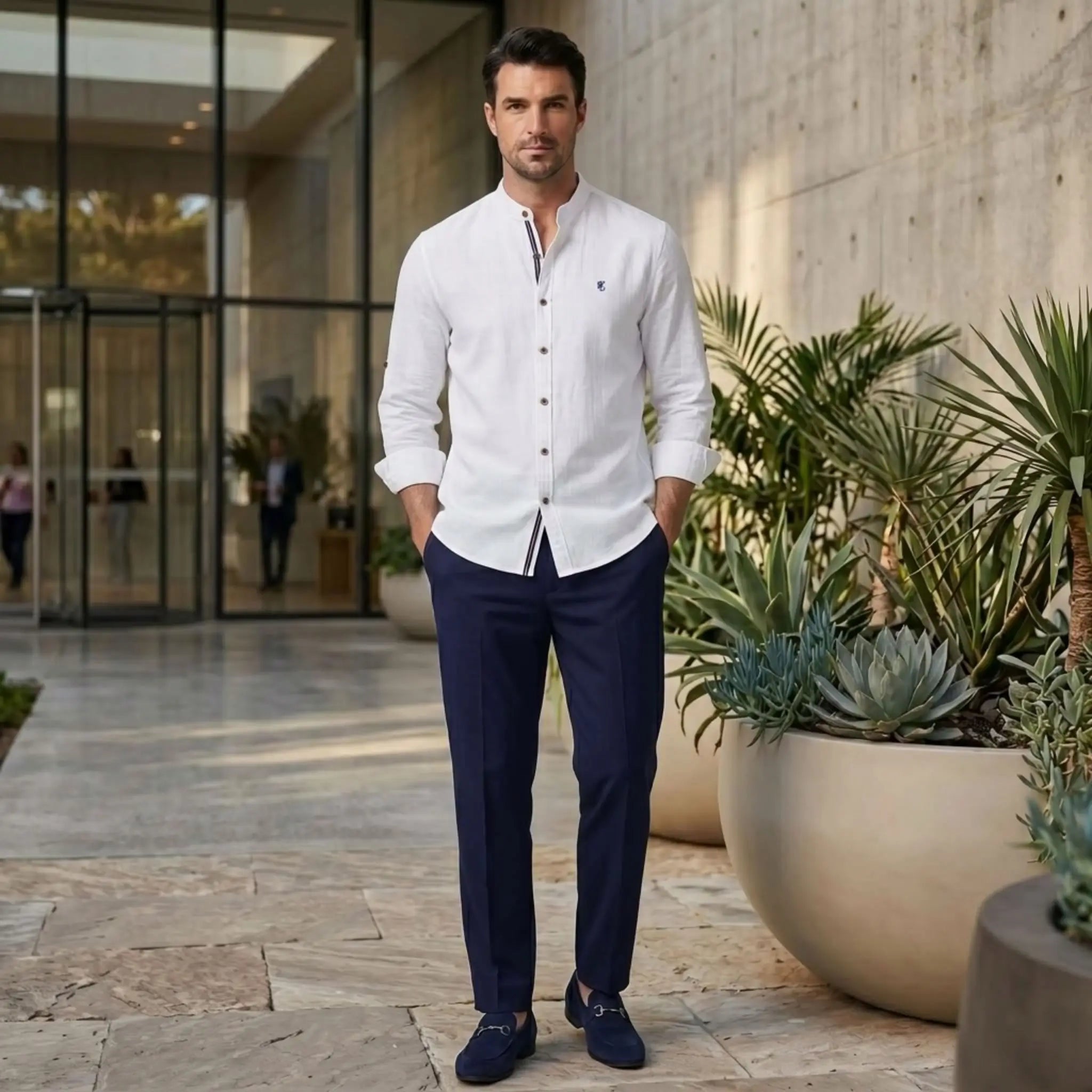 MannerCo white linen stand collar shirt and navy slim fit trousers 2-piece set on man outdoors