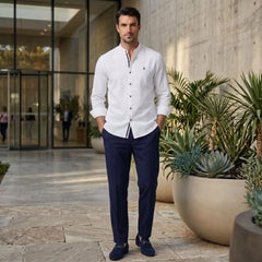 MannerCo white linen stand collar shirt and navy slim fit trousers 2-piece set on man outdoors