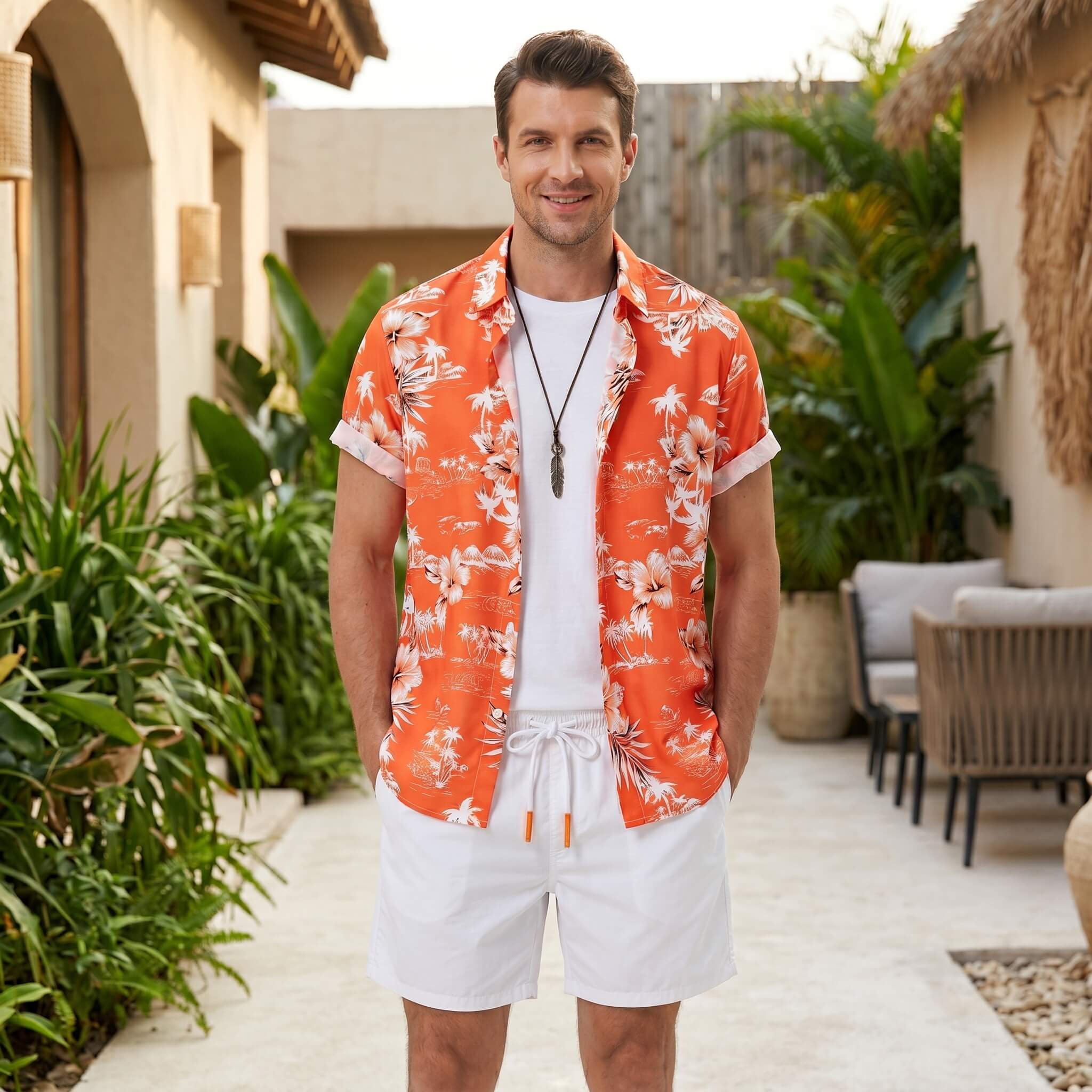 Man in white palm tree tropical print shirt and swim shorts in outdoor beach lifestyle setting