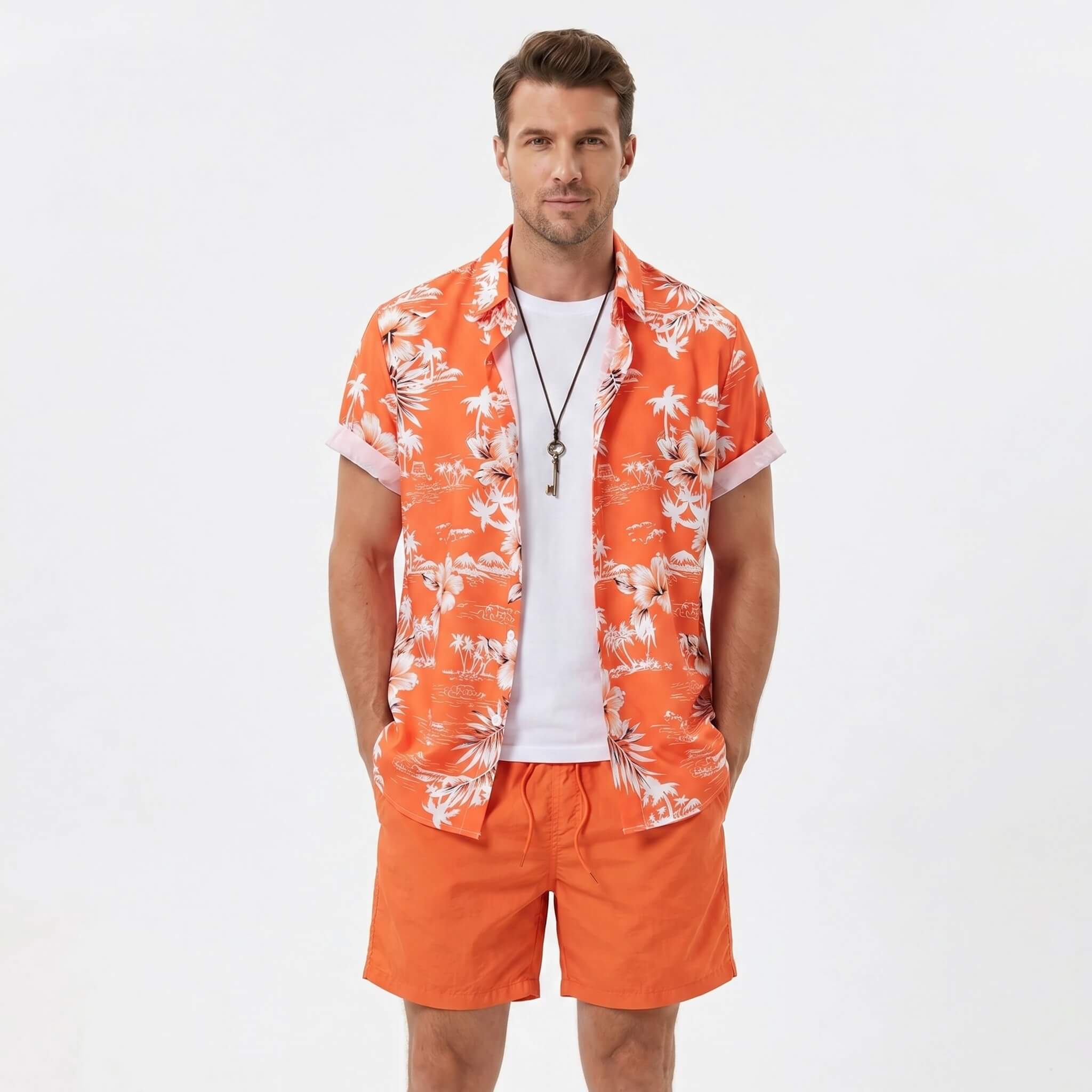 Man in white palm tree tropical print shirt and swim shorts in tropical outdoor vacation setting