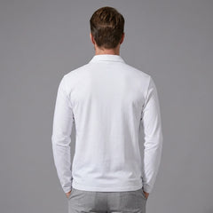 Back view of man wearing white solid long sleeve cotton polo shirt