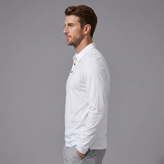 Side view of man wearing white solid long sleeve cotton polo shirt with classic collar