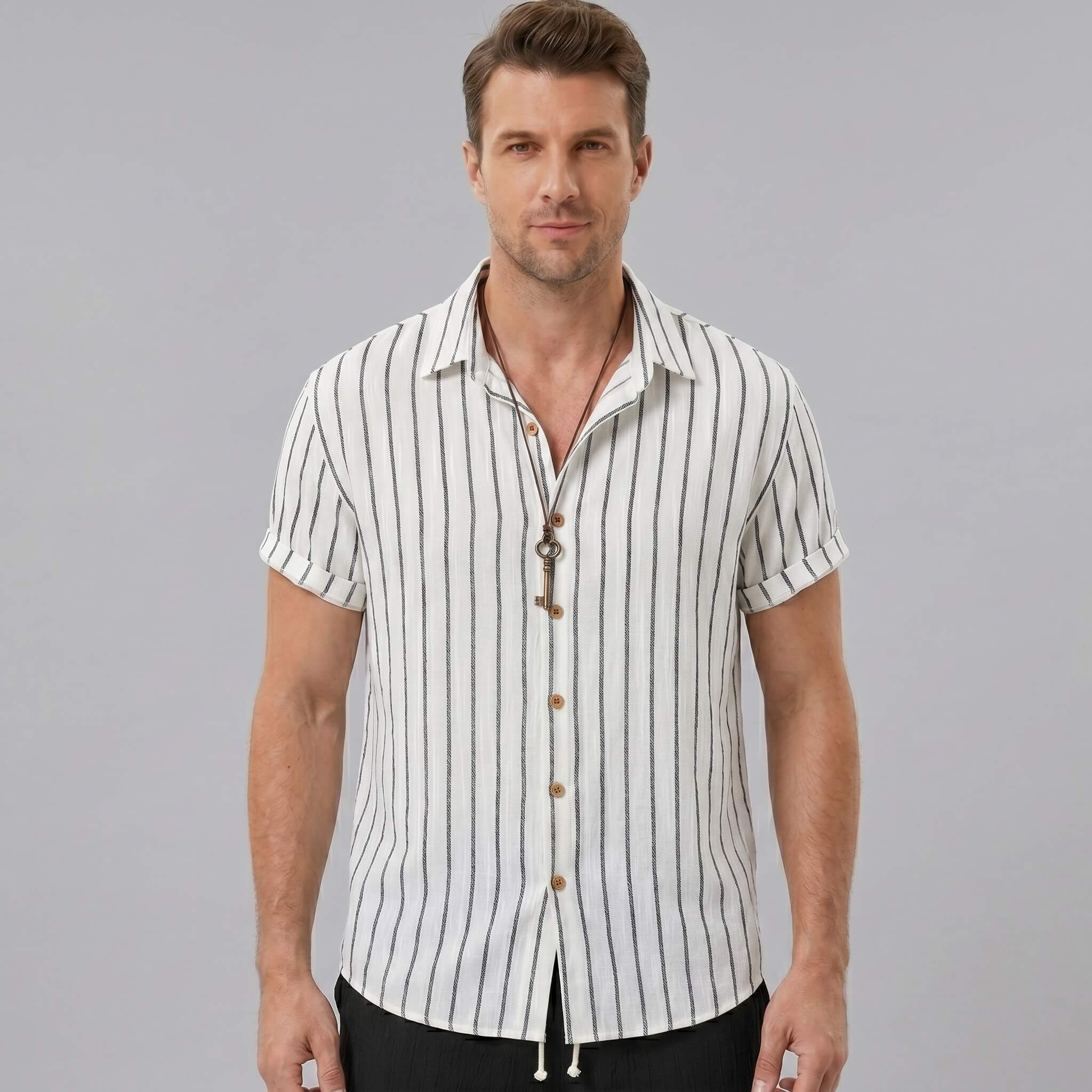 Back view of man wearing white striped cotton blend shirt and crinkle textured drawstring shorts