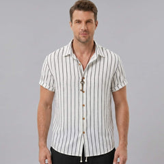 Back view of man wearing white striped cotton blend shirt and crinkle textured drawstring shorts