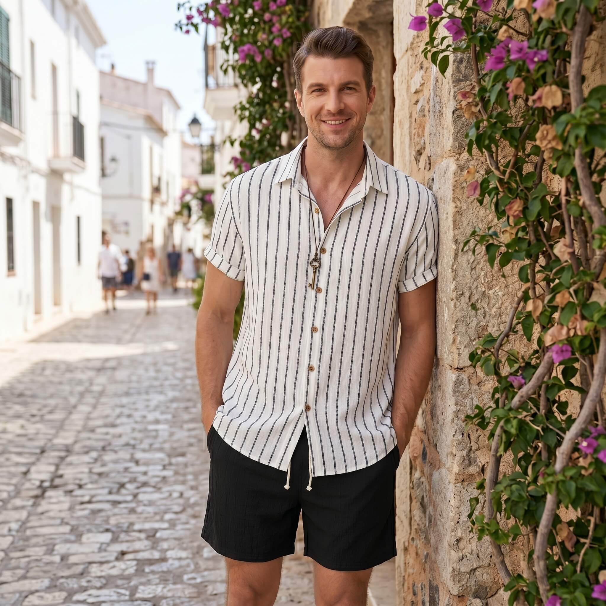 Man in white striped cotton blend shirt and crinkle drawstring shorts walking in sunny outdoor summer scene