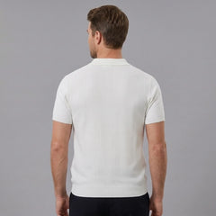 Side view of man in white striped knit slim fit polo shirt on plain background