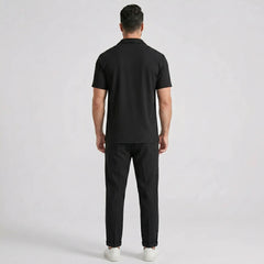 Side view of man in white waffle button up shirt and straight leg linen pants