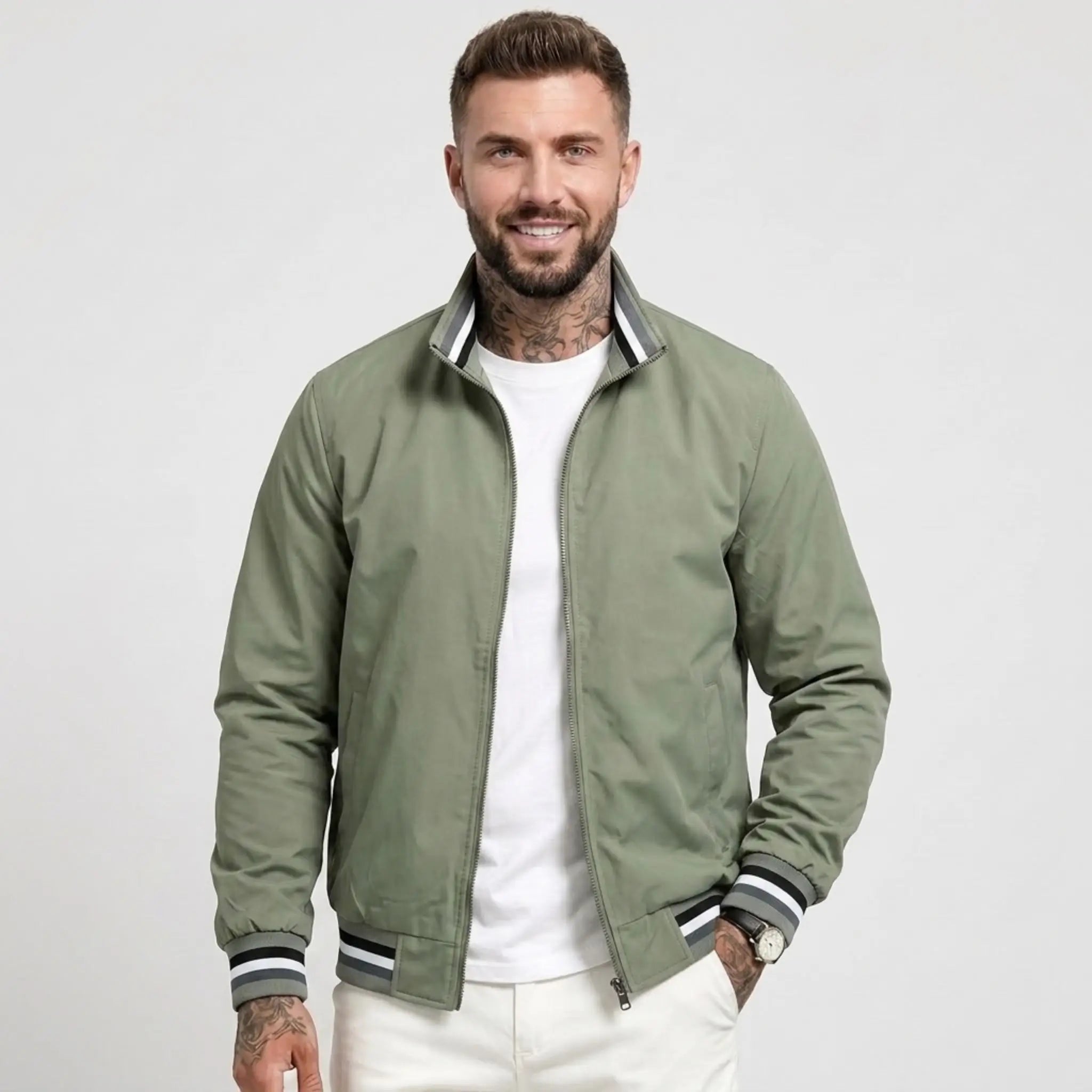 Man wearing MannerCo green waterproof windbreaker jacket with stand collar, front view