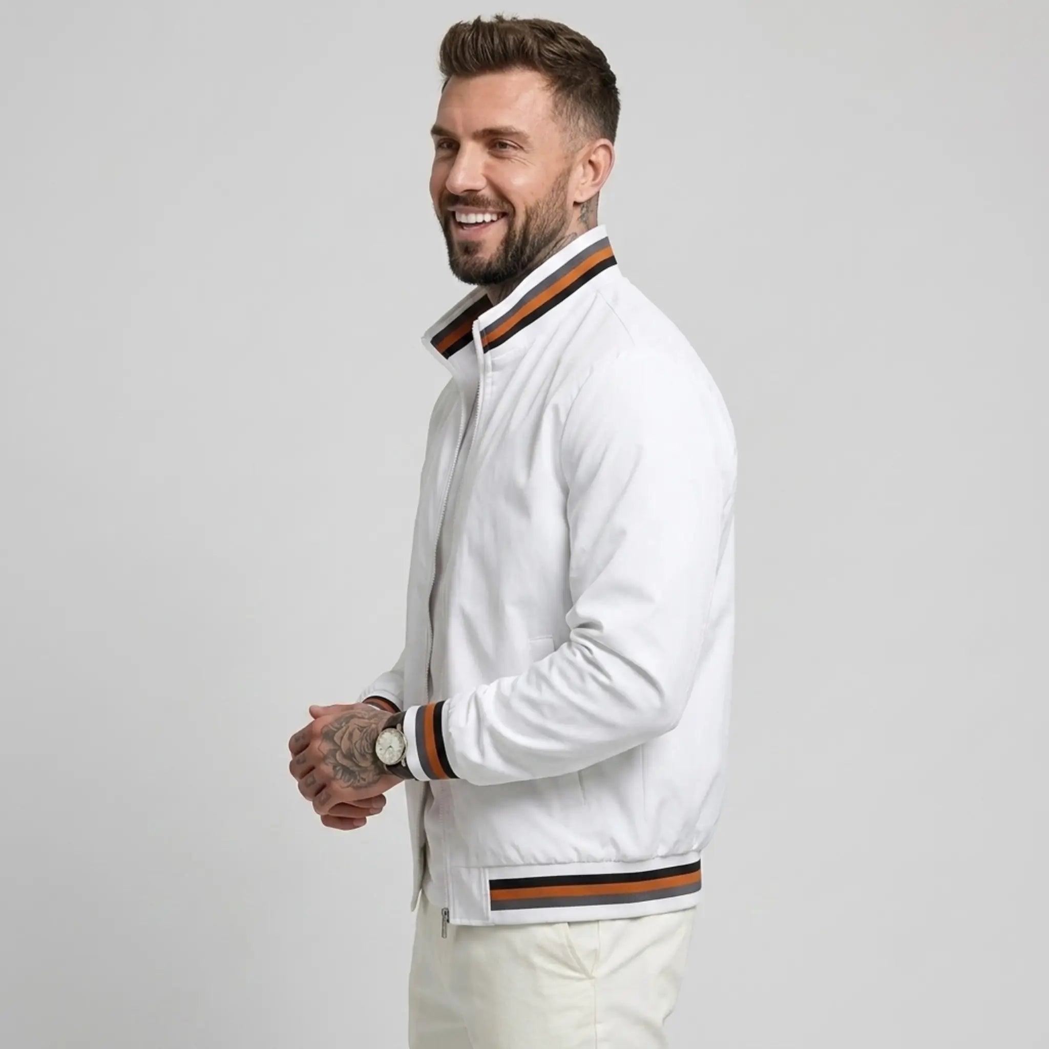 Man wearing MannerCo white waterproof windbreaker jacket with stand collar, side view