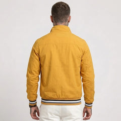 MannerCo yellow waterproof windbreaker jacket back view with striped collar and cuffs