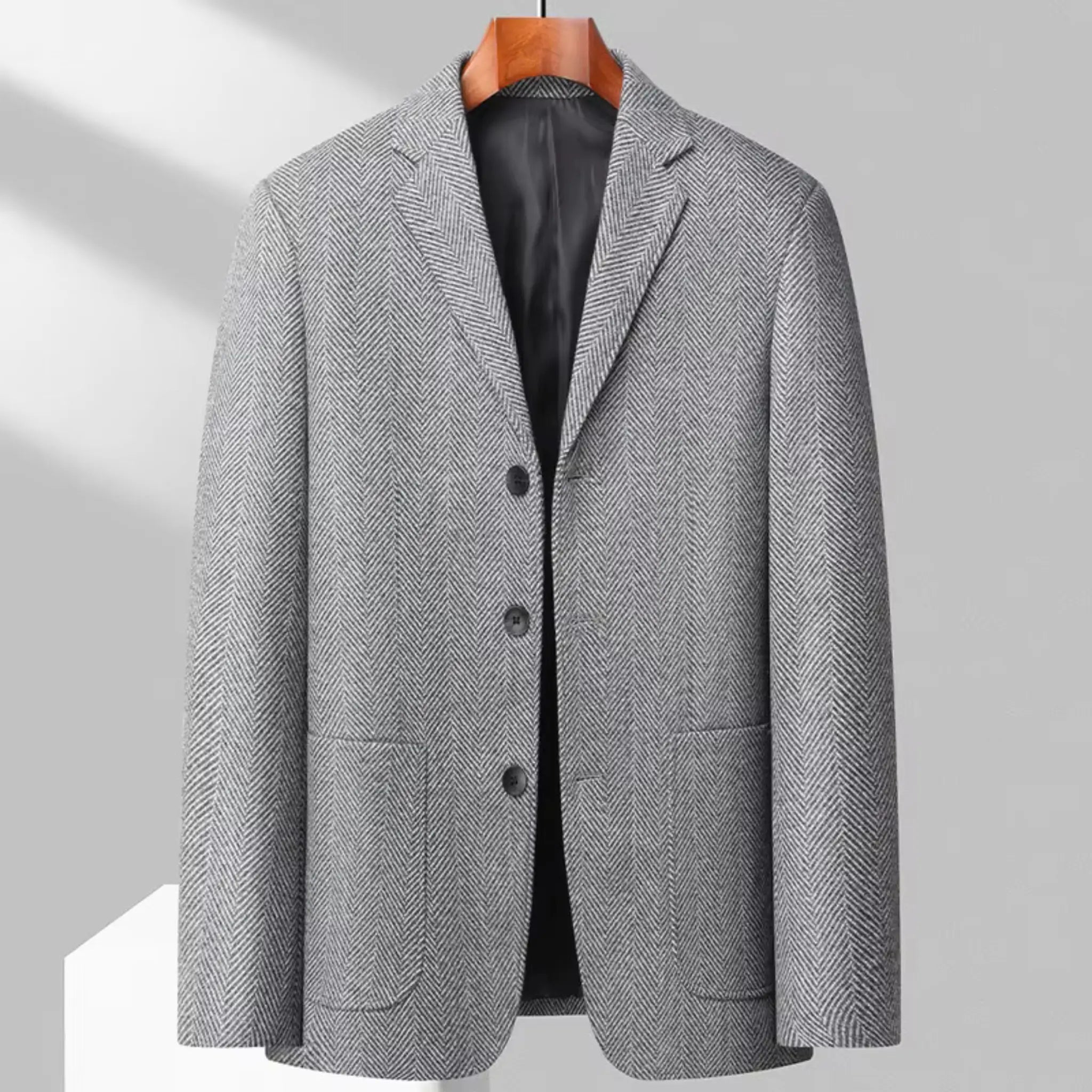 MannerCo gray woolen blazer three-button loose fit sport coat on wooden hanger display