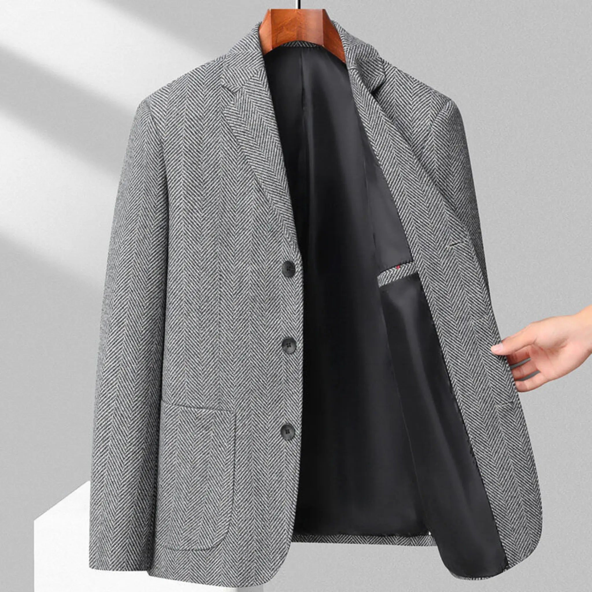 MannerCo gray woolen blazer on hanger open front showing black lining three-button closure