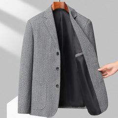 MannerCo gray woolen blazer on hanger open front showing black lining three-button closure