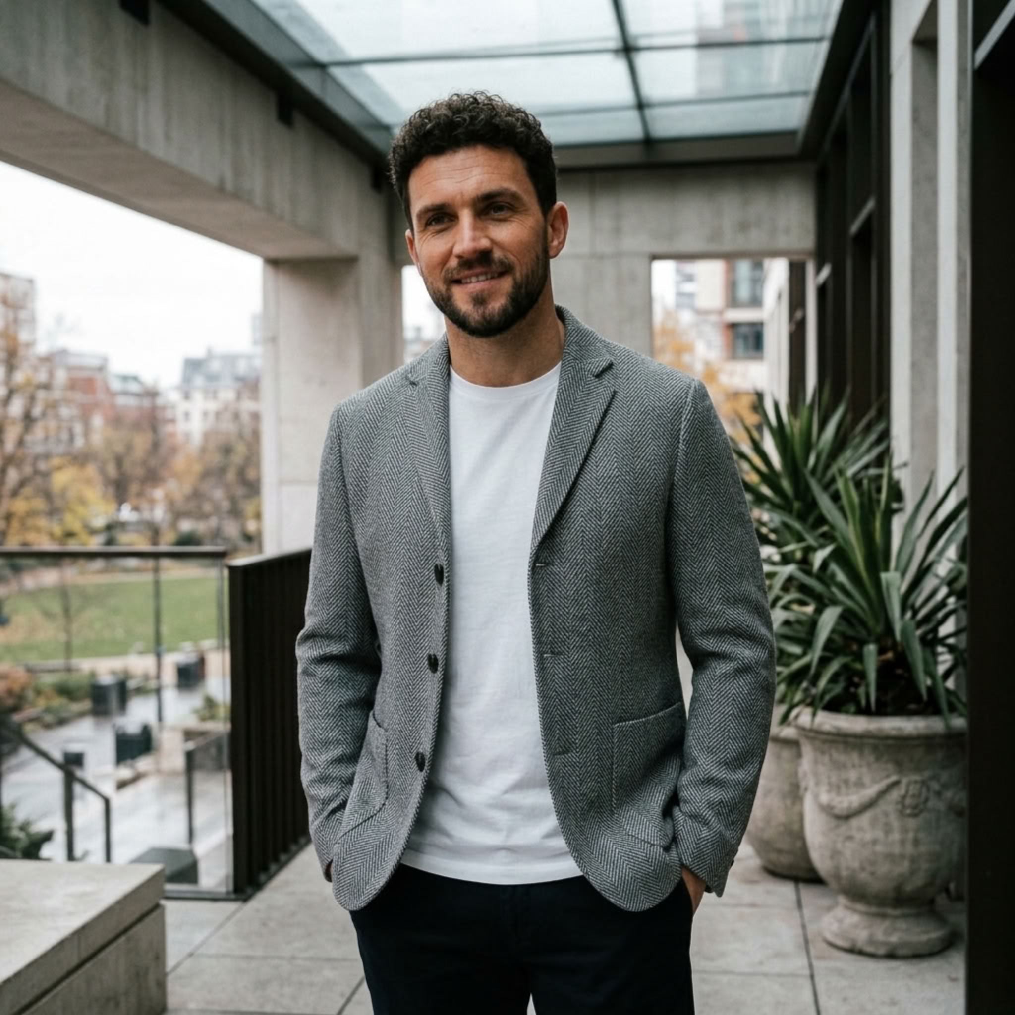 MannerCo gray woolen blazer relaxed fit styled with white tee and navy trousers indoor