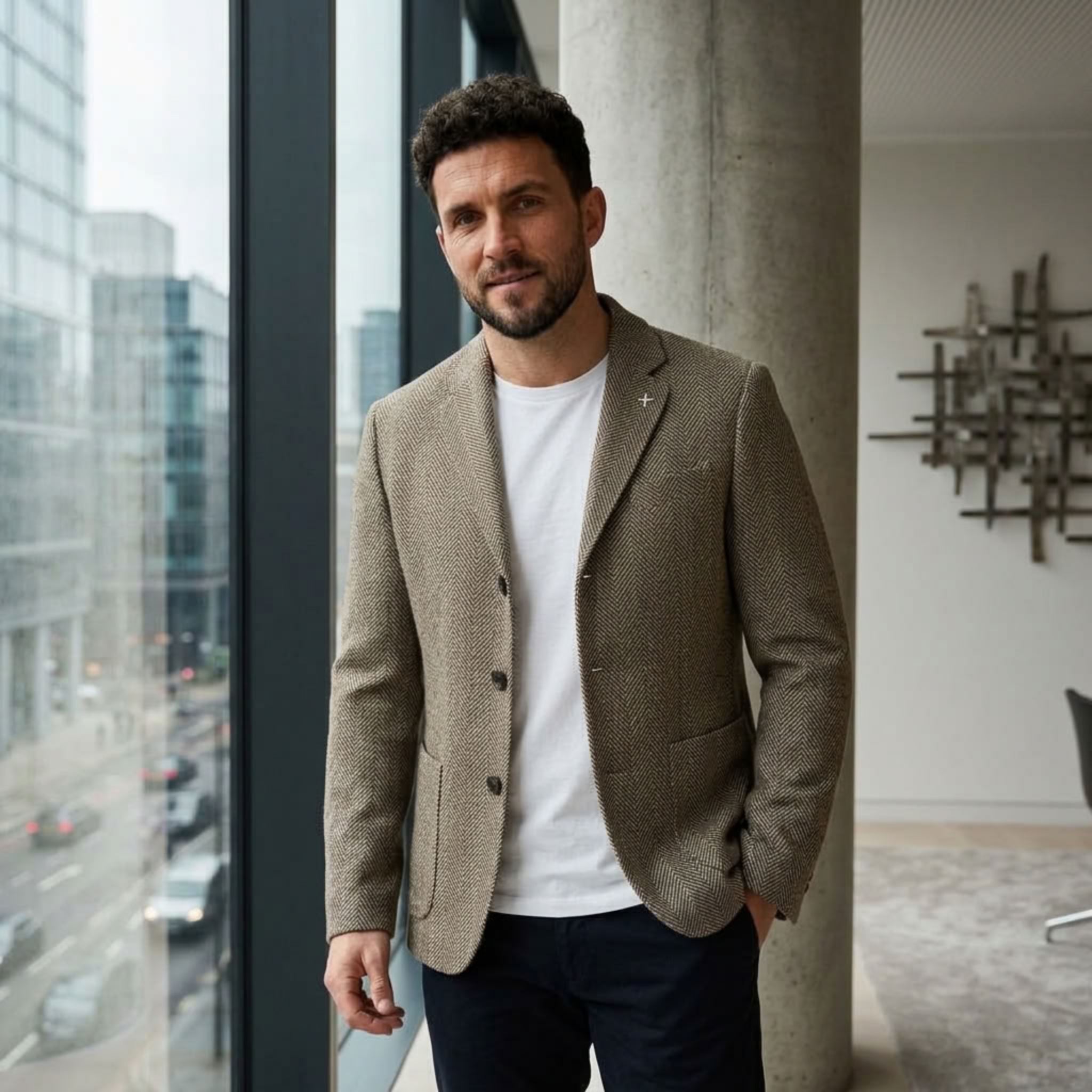 MannerCo khaki woolen blazer loose fit styled with white tee and navy trousers indoors