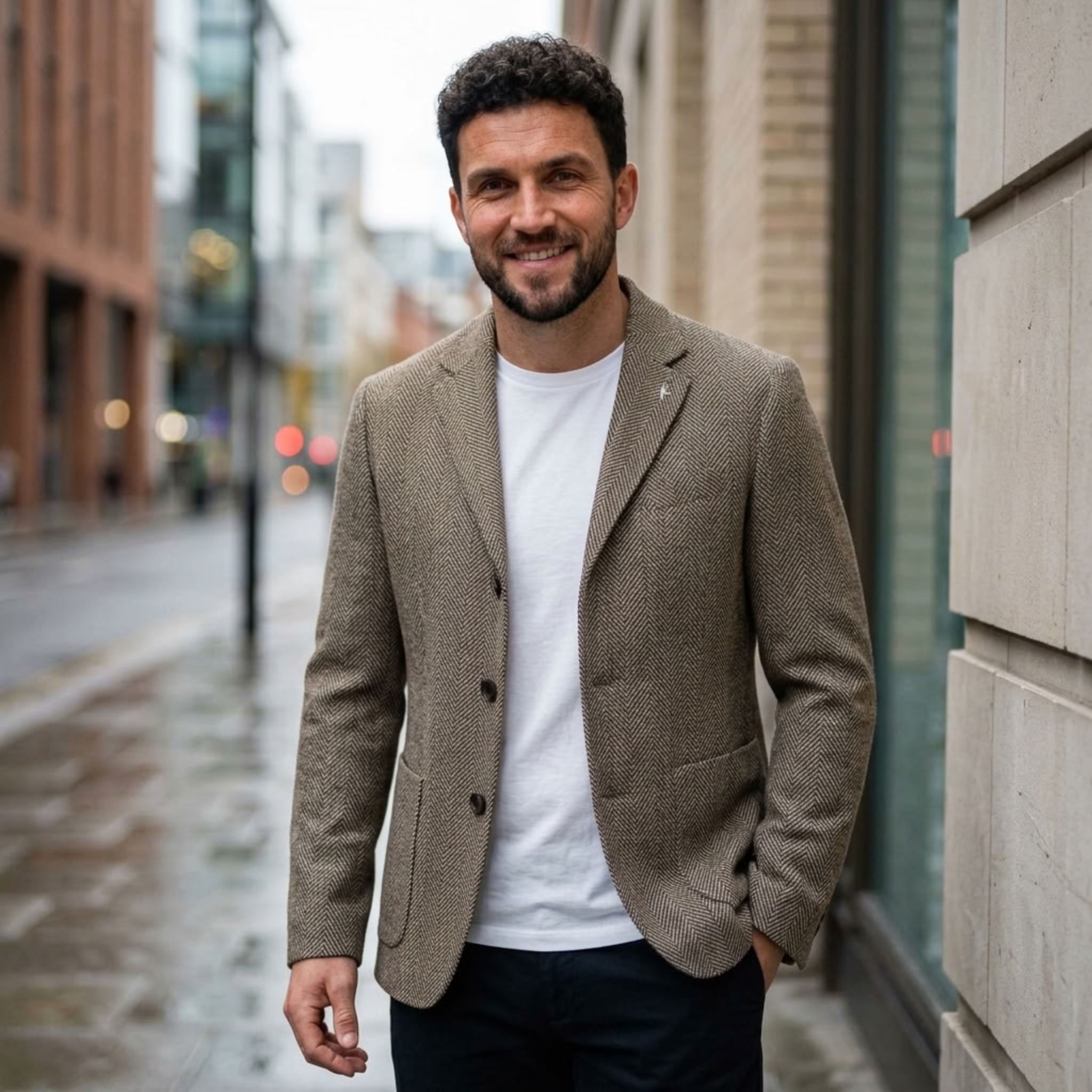 MannerCo khaki woolen blazer worn outdoors smart-casual style with white tee and navy trousers