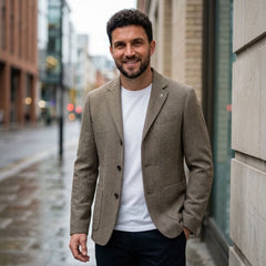 MannerCo khaki woolen blazer worn outdoors smart-casual style with white tee and navy trousers