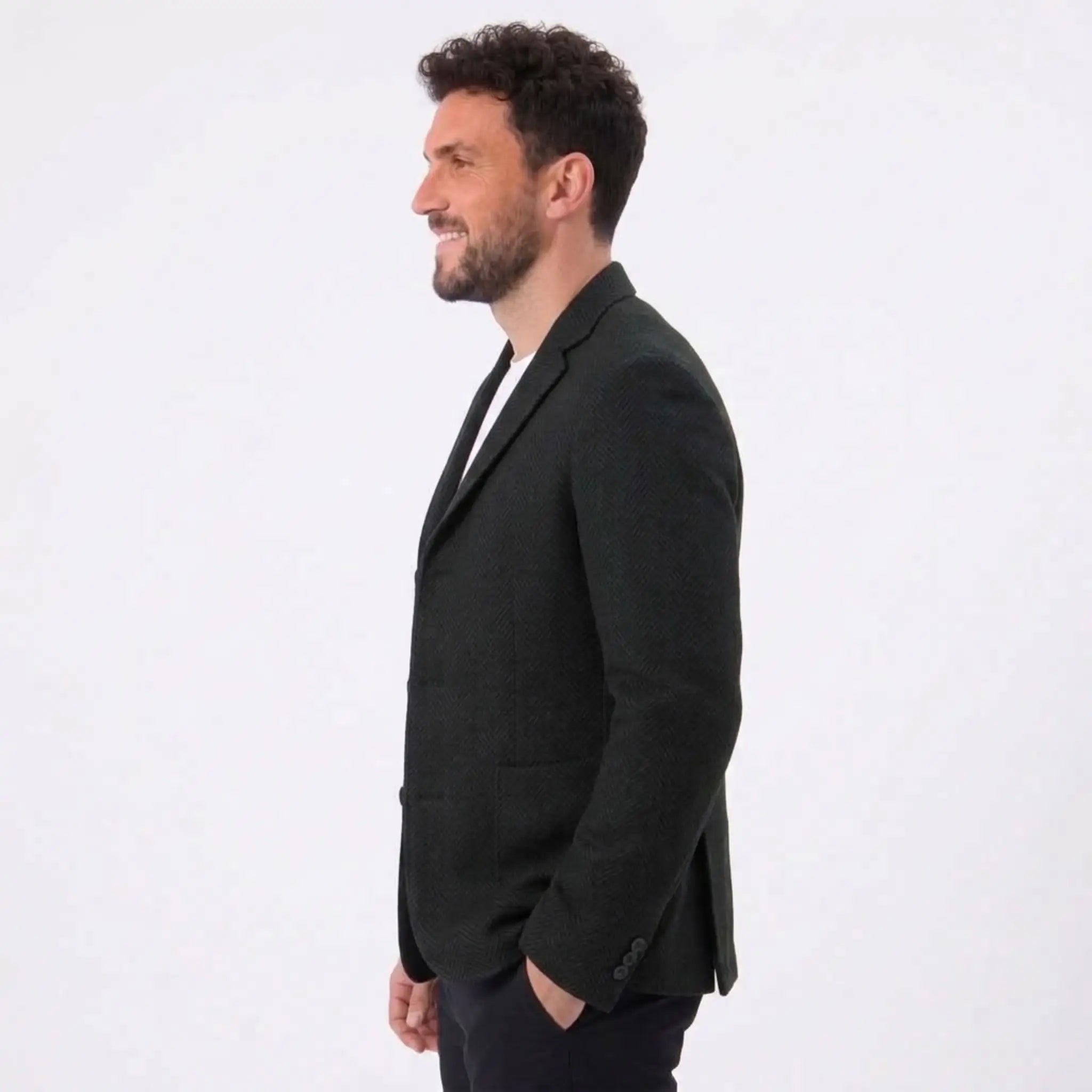 MannerCo dark blue woolen suit coat side view on male model loose fit blazer for spring autumn
