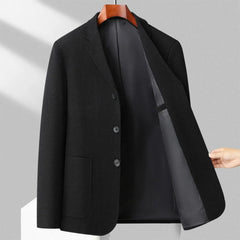 MannerCo black woolen blazer open front view showing dark satin lining on wooden hanger