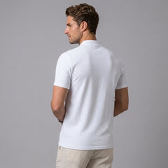 Side view of man in yellow linen jacquard short sleeve polo shirt