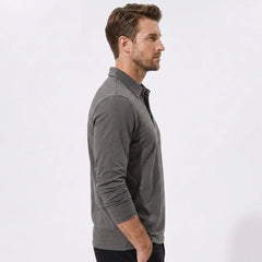 Back view of man wearing yellow solid long sleeve cotton polo shirt