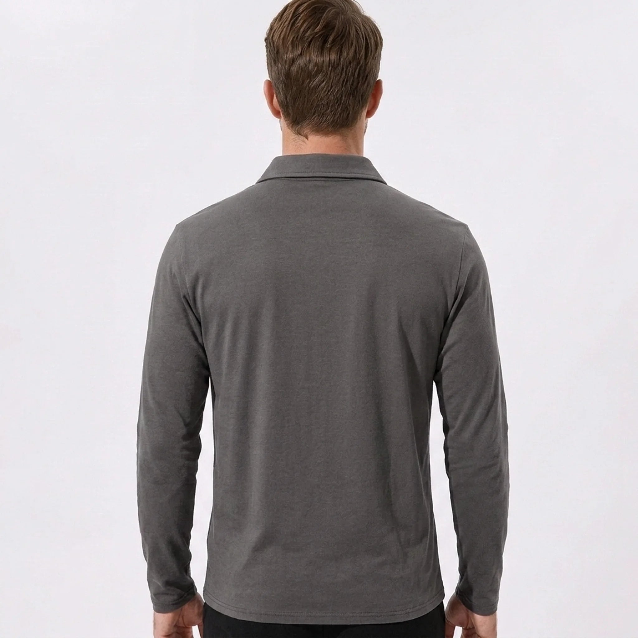 Side view of man in yellow solid long sleeve cotton polo shirt