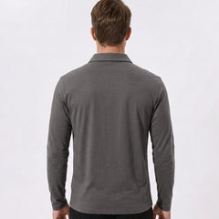 Side view of man in yellow solid long sleeve cotton polo shirt